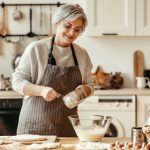 Happy,Old,Woman,Granny,Cooks,In,Kitchen,Kneads,Dough,And